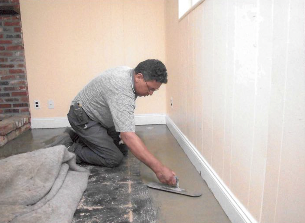 a person doing basement waterproofing work